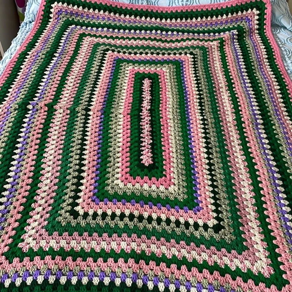 Knitted afghan /throw vintage item greens/pinks with a hint of purple